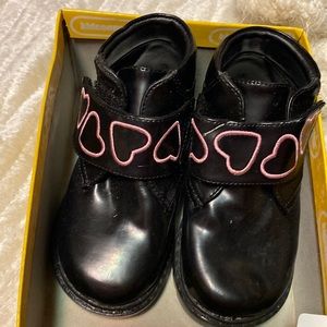 Pink and black boots